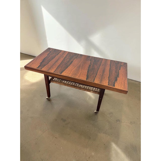 Mid-Century Modern Scandinavian Indonesian Rosewood Coffee Table on Wheels with Magazine Rack, 1960s For Sale - Image 3 of 10