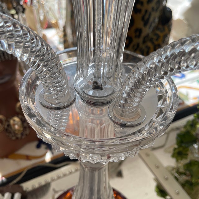 Late 20th century, French A three-light candelabra lamp crafted from clear and amber crystal. It features a round amber...