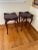 Two matching, elegant side tables that would go perfect next to a bed or couch. The date these were made is unknown. They...