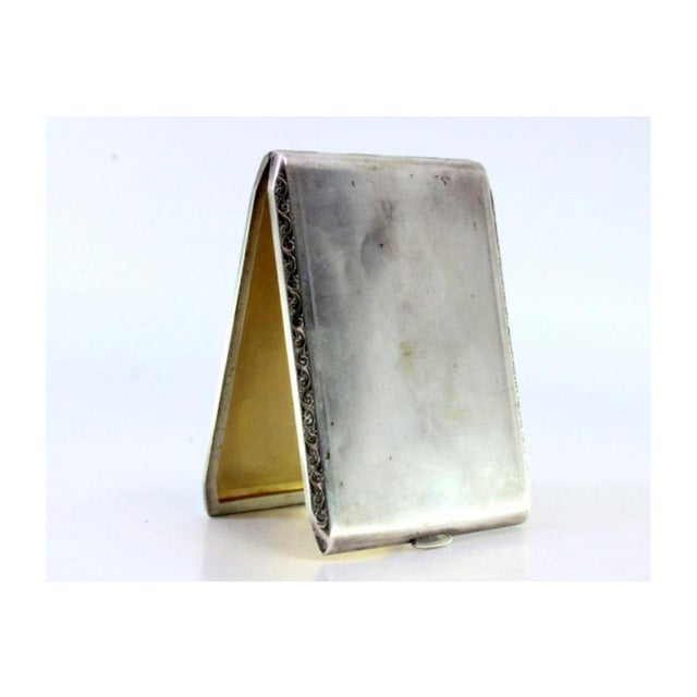 Matte Silver Cigarette Case with Raised Trim, in Very Good conditions. Designed 1920 to 1949 This piece has an attribution...