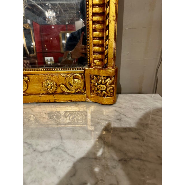 wowza! This Louis XVI period mirror has been completely restored after someone in the 1980s slathered it in pink paint. I...