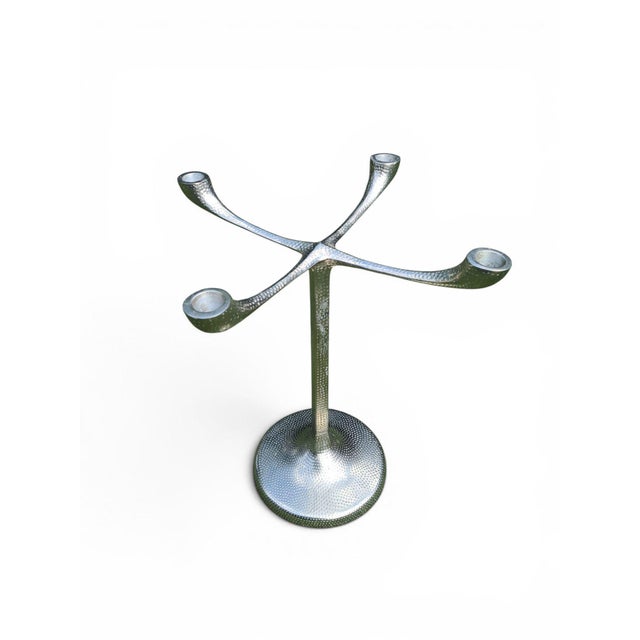 An original four-arm decorative candlestick by lambert, manufactured in west germany in the 1970s. a sculptural form with...