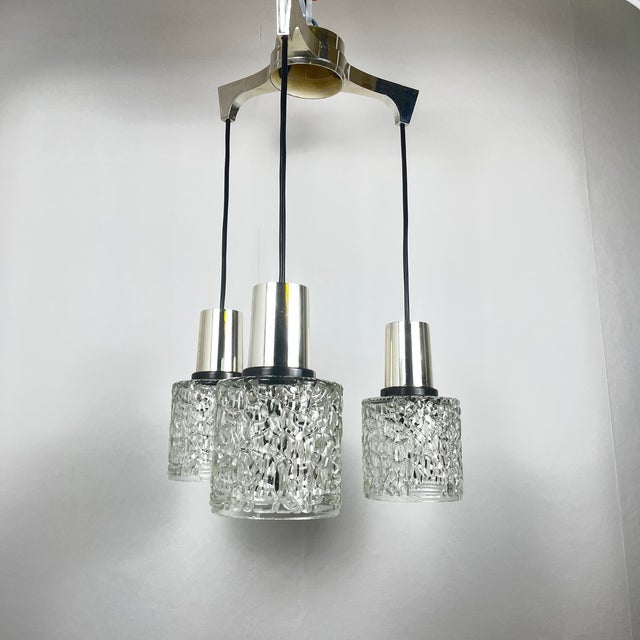 Three-light cascade pendant lamp, glass, 1970 Dimensions: Total height: 56.5 cm Diameter: 35 cm Globe diameter: 12 cm...