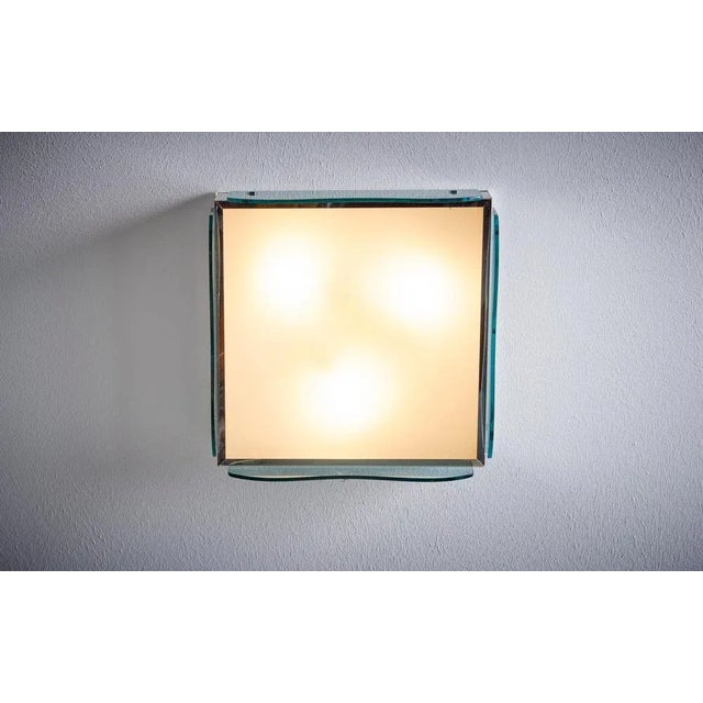 1960s Design Italian Wall Lamp nos in tinted green glass. Up to 250V (Europe/UK Standard).The wiring of this item may be...