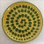 This Italian charger features a pattern of green circles spiraling across a yellow ground, with red zig zags adding a...