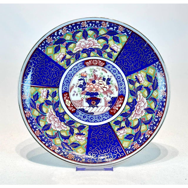 This vintage Japanese Arita Imari hand painted charger/plate is a stunning piece that will make a beautiful addition to...