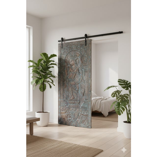 This vintage hand-carved wooden wall panel beautifully portrays Lord Krishna playing the flute beside his sacred cow, a...