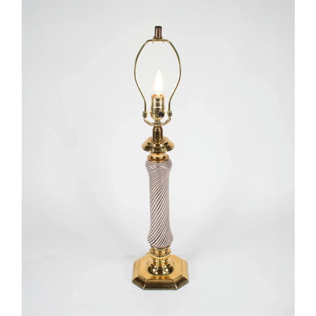 This midcentury Murano glass table lamp is crafted in the style of renowned glassmaker Dino Martens for Aureliano Toso. It...