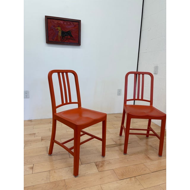 Set of five Emeco 111 Navy Chairs in striking Coca-Cola red. Each chair is crafted from 111 recycled plastic bottles, a...
