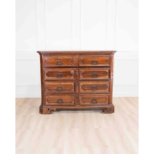 A distinguished early 18th century Lombard chest of drawers, beautifully crafted in solid walnut and rich with the...