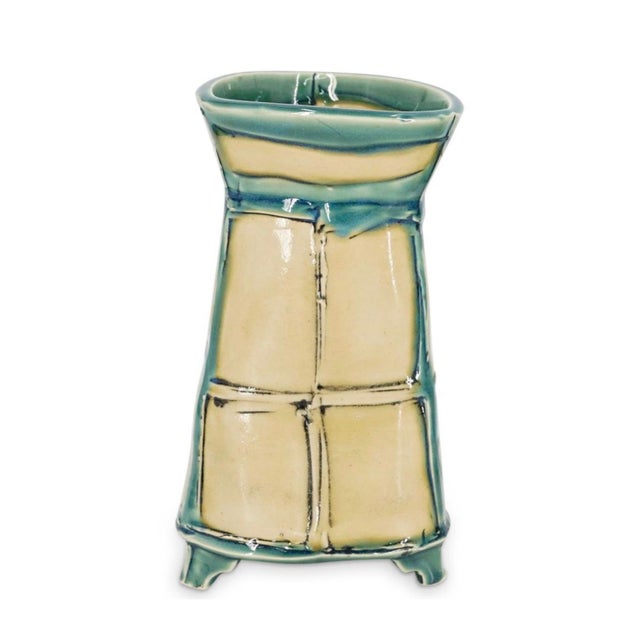 Tableware set featuring a teapot, cups, and a vase, each featuring two-tone geometric patterns. Each piece is signed...