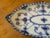 Hand painted cobalt blue motifs used as a pickle dish, spoon tray, or small serving platter.