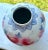 A vintage Chinese porcelain vase in great condition. White backdrop, hand painted large pink flowers and blue leaves,...
