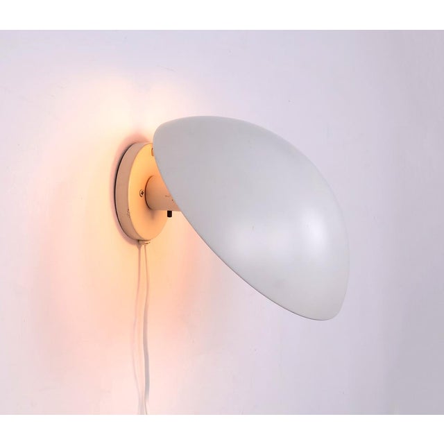 Original PH-Hat wall lamp designed by Poul Henningsen for Louis Poulsen. This iconic Danish design is characterized by the...