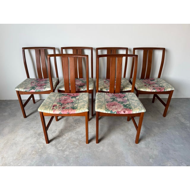 A refined set of six Mid-Century Danish Modern dining chairs, attributed to Linde Nilsson for Lammhults of Sweden. Crafted...