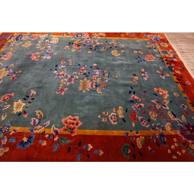 1920s Tranquil and Calming Light Blue Background With Warm Red Field and Magnificent Array of Multicolored Floral Motifs Antique Chinese Art Deco Rug For Sale - Image 5 of 15