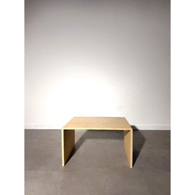 Elegant vintage side table crafted in beautiful beige travertine, featuring a timeless minimalist design and clean...