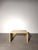 Elegant vintage side table crafted in beautiful beige travertine, featuring a timeless minimalist design and clean...