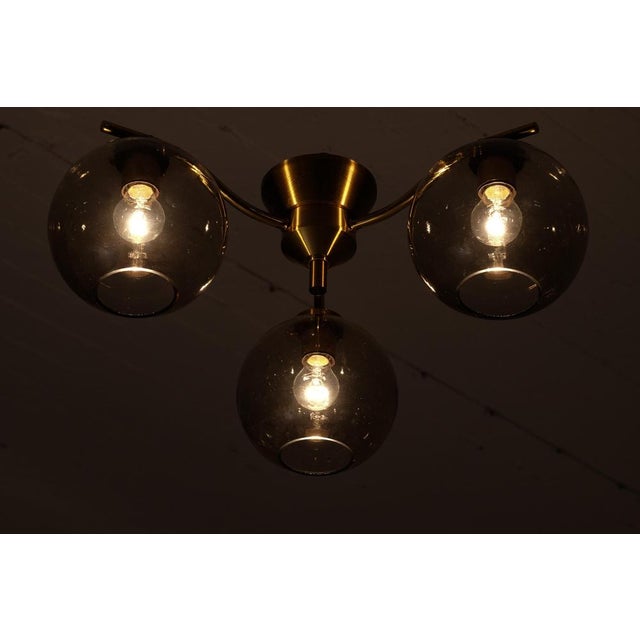 Set of 3 available, listed price is for one (1) lamp. Designed by Holger Johansson and produced in Sweden by his own...