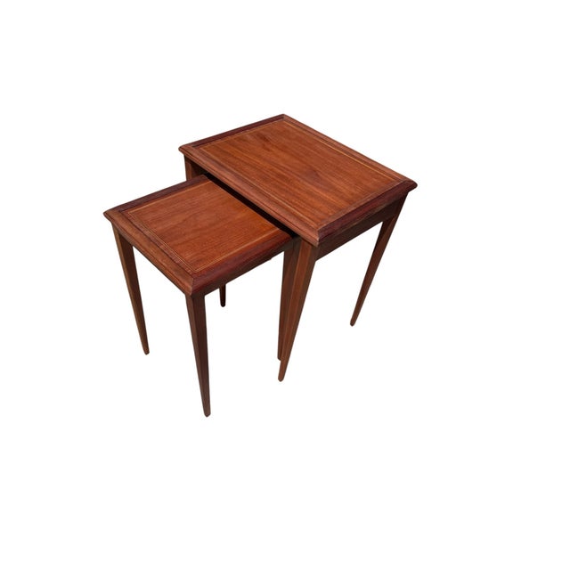 An elegant pair of vintage nesting tables by LB Van Server Co., beautifully crafted from solid mahogany and featuring...