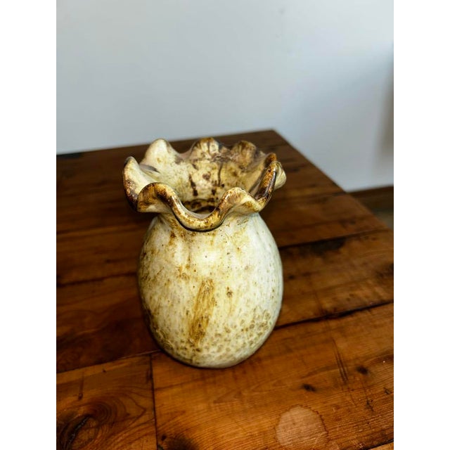 Add a touch of organic artistry and rustic charm to your home with this delightful vintage studio pottery vase. This...