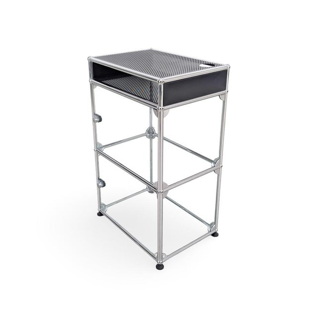 We are offering a beautiful usm haller hi-fi cabinet made of glass and metal with two custom-made storage compartments for...