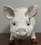 Hand made terra cotta pig or sow with a tin glaze and glass eyes.
