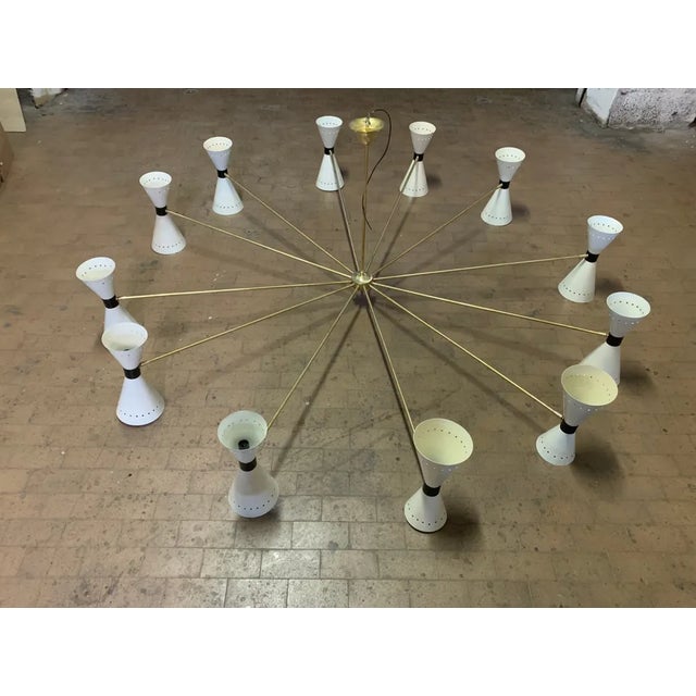 Very rare hotel chandelier, produced by Stilnovo in the 1950s, mounts 12 arms with cones, and 24 light points, come from a...