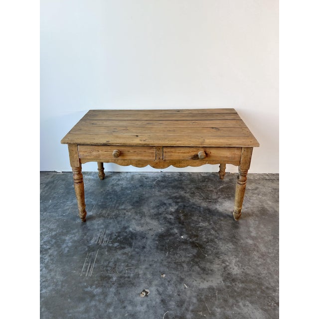 A darling English antique scalloped front accent table. Rustic patina, and a soft neutral brown wax finish, there is some...