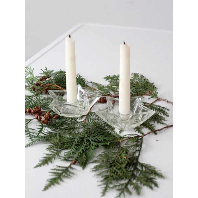 This is a pair of vintage star shaped glass candlestick holders. The mid-century cut glass candle holders hold a standard...