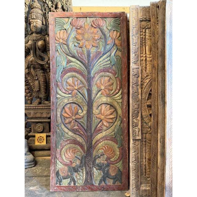 A stunning example of traditional Indian craftsmanship, this vintage hand-carved wood barn door features an intricate Tree...