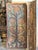 A stunning example of traditional Indian craftsmanship, this vintage hand-carved wood barn door features an intricate Tree...