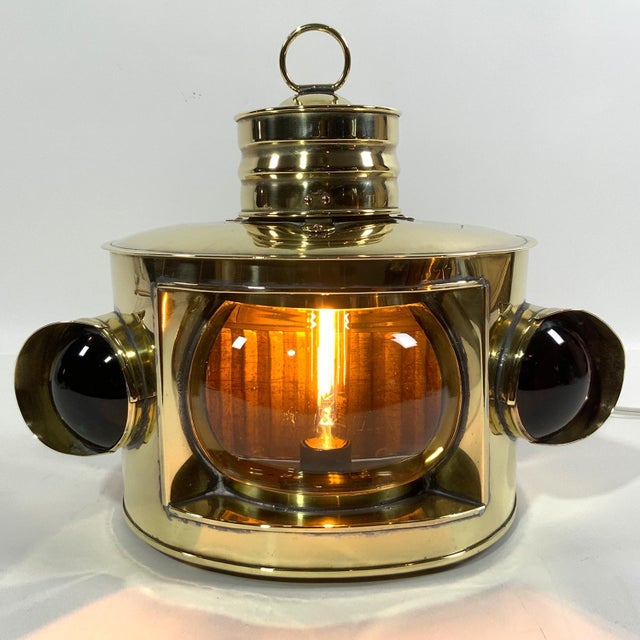 Highly polished brass yacht lantern with clear masthead lens and res and green bullseye glass port and starboard lenses....