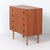 Danish teak chest of drawers from the 1960s with four spacious drawers, distinctive recessed handles and an original key....