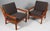 Juul Kristensen pair of lounge chairs in teak. Cushions upholstered with grey wool fabric. Made by Juul Kristensen in the...