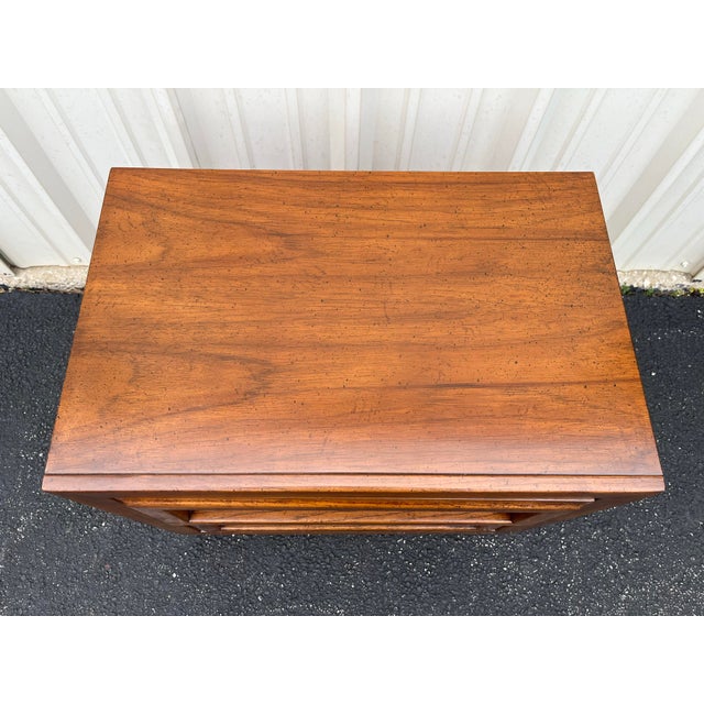 A pair of 1960s Dixie brutalist style nightstands. Each features a classic mid century modern body type with brutalist...