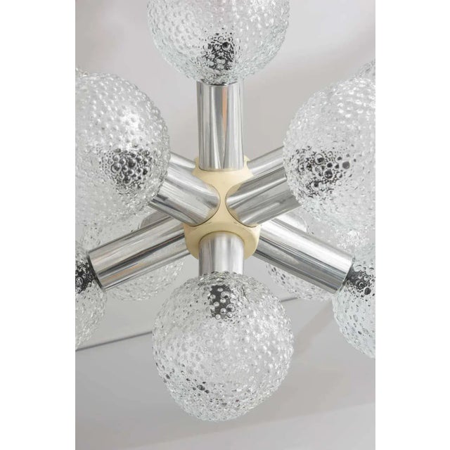This stylish Mid-Century Modern chandelier dates to the 1960s in Germany, and it seems to take its inspiration from a star...