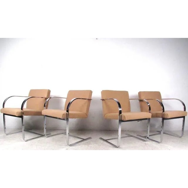 This set of four flat chrome Brno dining chairs feature the exquisite vintage cantilever design that so adeptly mixes...