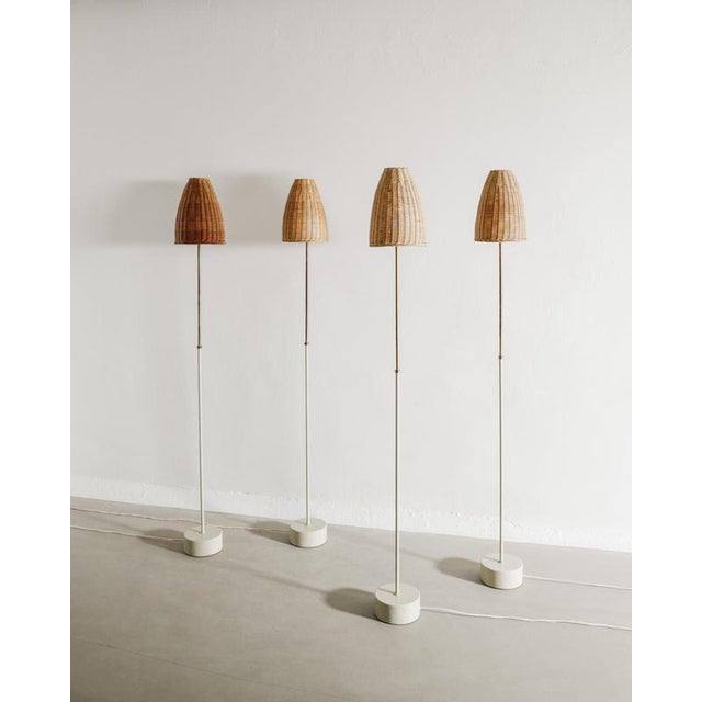 A very rare set of four swedish mid century "s-1871" floor lamps in grey lacquered metal and brass with beautiful matching...