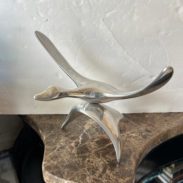 Bird in flight silver metal sculpture made by hand by artist Hoselton, signed and numbered 147A.