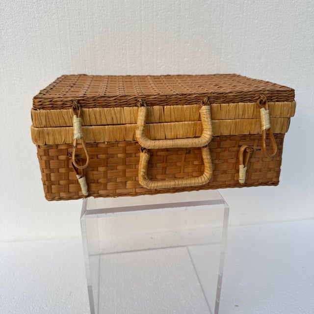 Woven wicker basket in good condition. Has original wicker closures and two handles. There are some small holes on the...