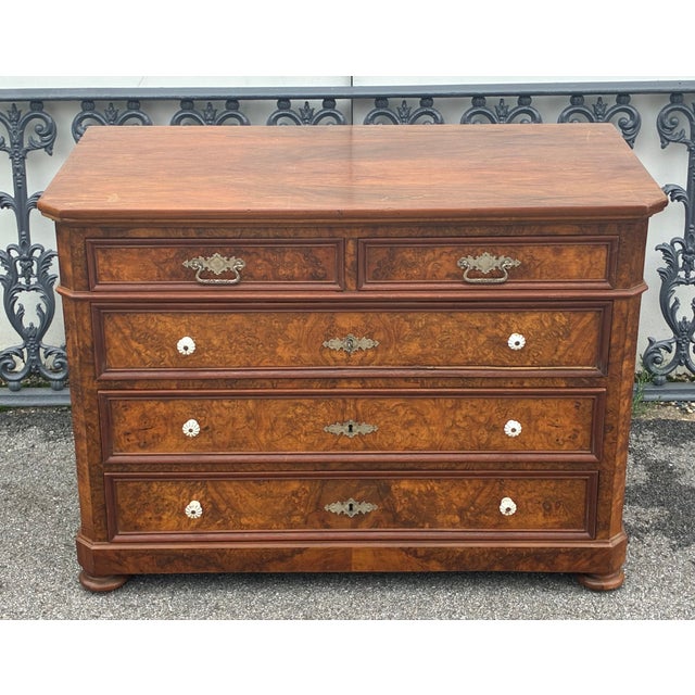 It is rare for us to offer a walnut chest for sale, but this little five drawer piece is so pretty that we could not...