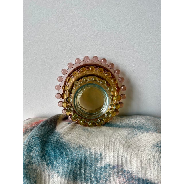 Nesting set of colorful ashtrays in pink, yellow, blue. Imperial Glass Company is an Ohio-based American glass company...