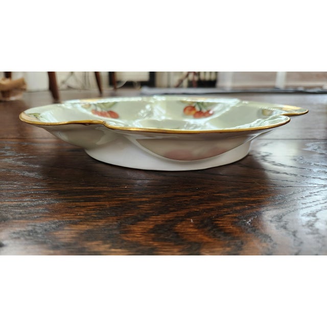 An elegant antique French porcelain oyster plate by Haviland & Co. of Limoges, circa 1900–1915. The sculptural plate...