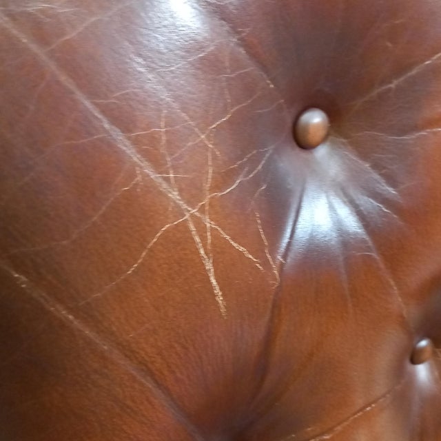 Vintage leather designer armchair from the 1960s – cowhide with steel studs Discover this iconic vintage armchair from the...