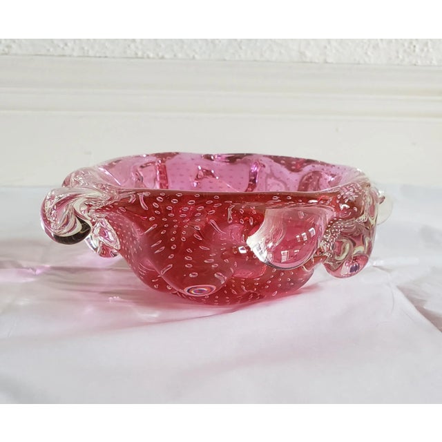 Beautiful mid-century Archimede Seguso Murano Attributed Bullicante bowls in a gorgeous cranberry pink color. This is a...