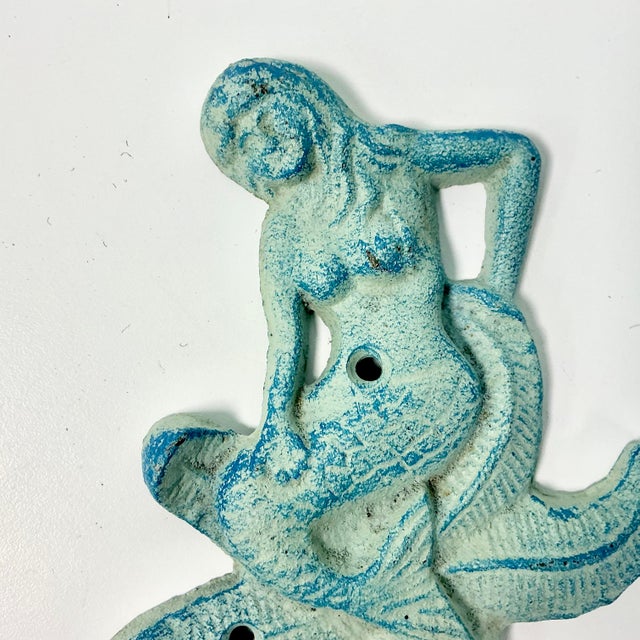 We couldn’t pick this fabulous Wall Hook up fast enough when we saw it. The cast iron item is a Mermaid sitting on a...