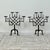 Pair of Gothic Style Wrought Iron Candelabra. The four sconces heads supported on a symmetrical lattice frame with claw...