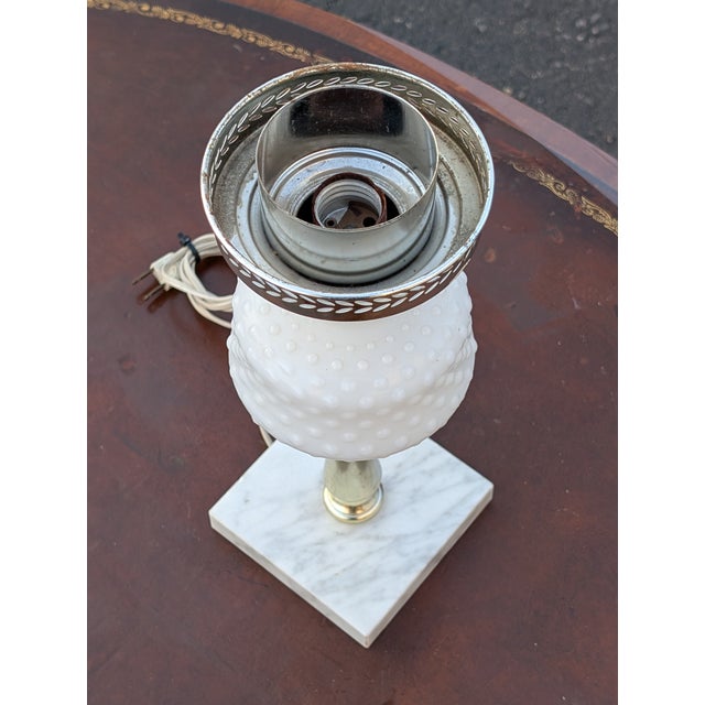 Elevate your interior lighting with this sophisticated vintage milk glass table lamp, a quintessential example of mid-...