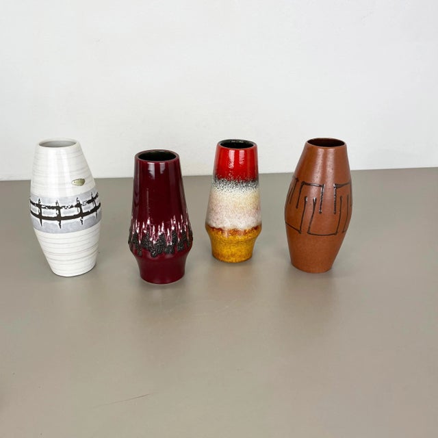 Set of 4 fat lava art vases Producer: Scheurich, Germany Decade: 1970s model: 309-20 248-22 These original vintage vases...